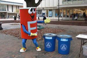 E-guy recycling mascot with recycling containers in The Pit at UNC.